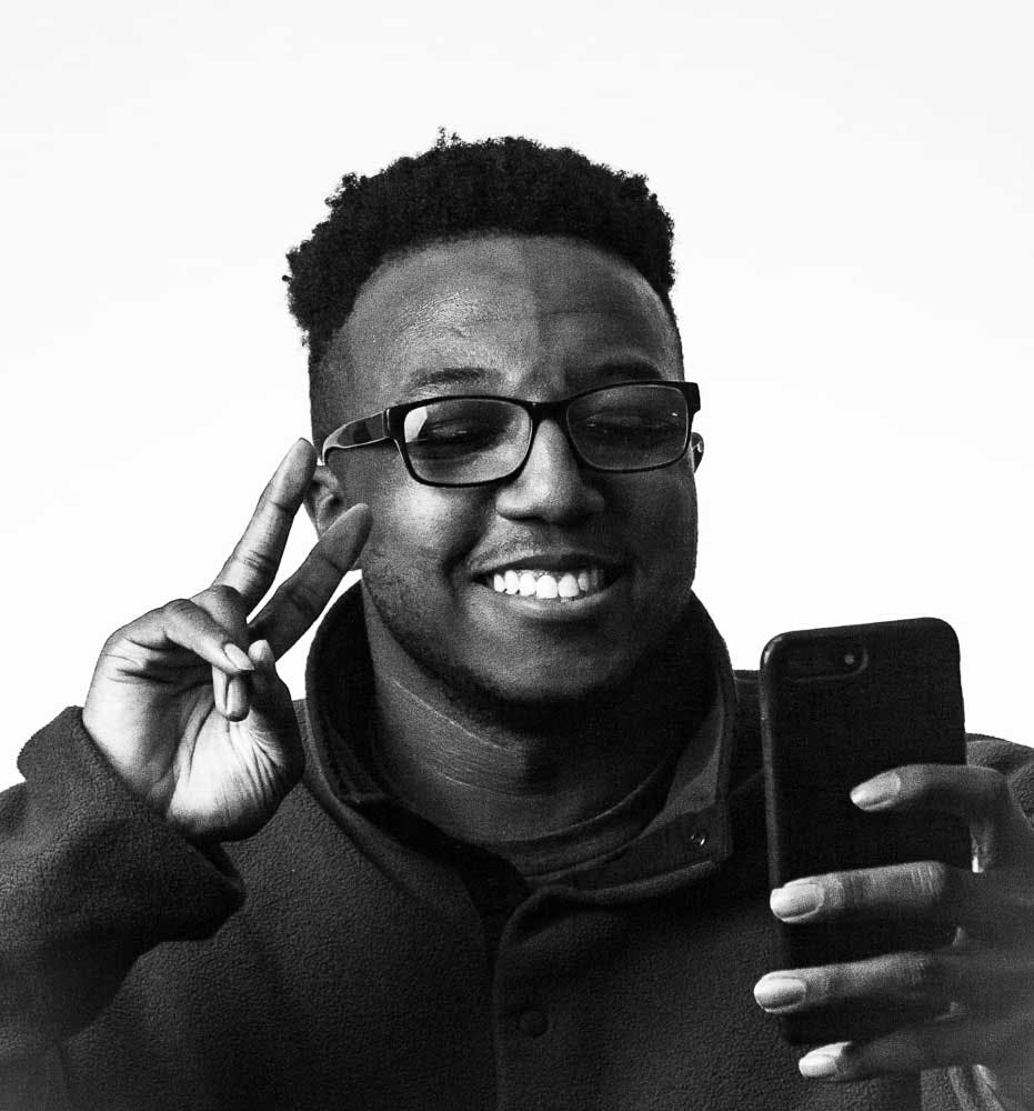 black and white photo of scholar DaManuel Montgomery