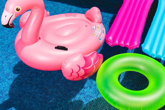 An image of pool toys to represent a look in the life of a mom’s summer and how to survive
